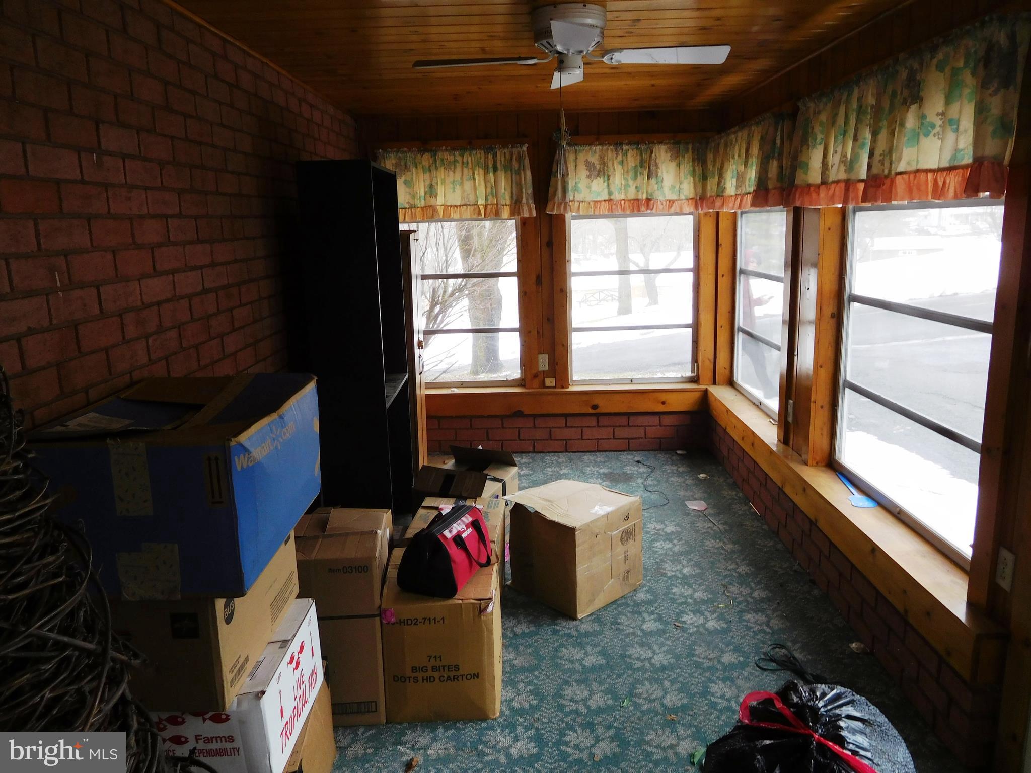 14920 Cemetery Road Midland, MD 21532 - Photo 7 of 26 a living room with furniture and a floor to ceiling window