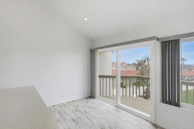 a view of entryway with wooden floor