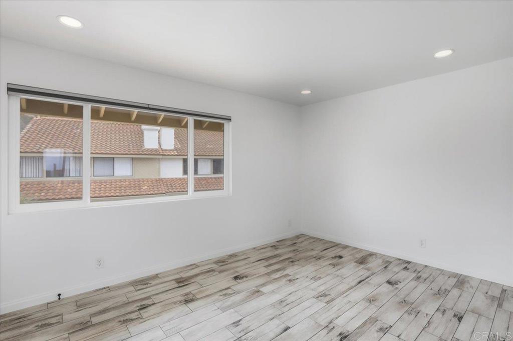 6686 Corte Maria Carlsbad, CA 92009 - Photo 16 of 28 a view of empty room with wooden floor