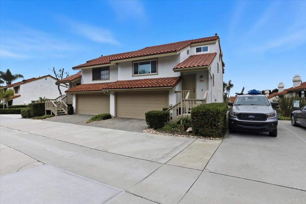 6686 Corte Maria Carlsbad, CA 92009 - Photo 2 of 28 a view of a car park in front of house