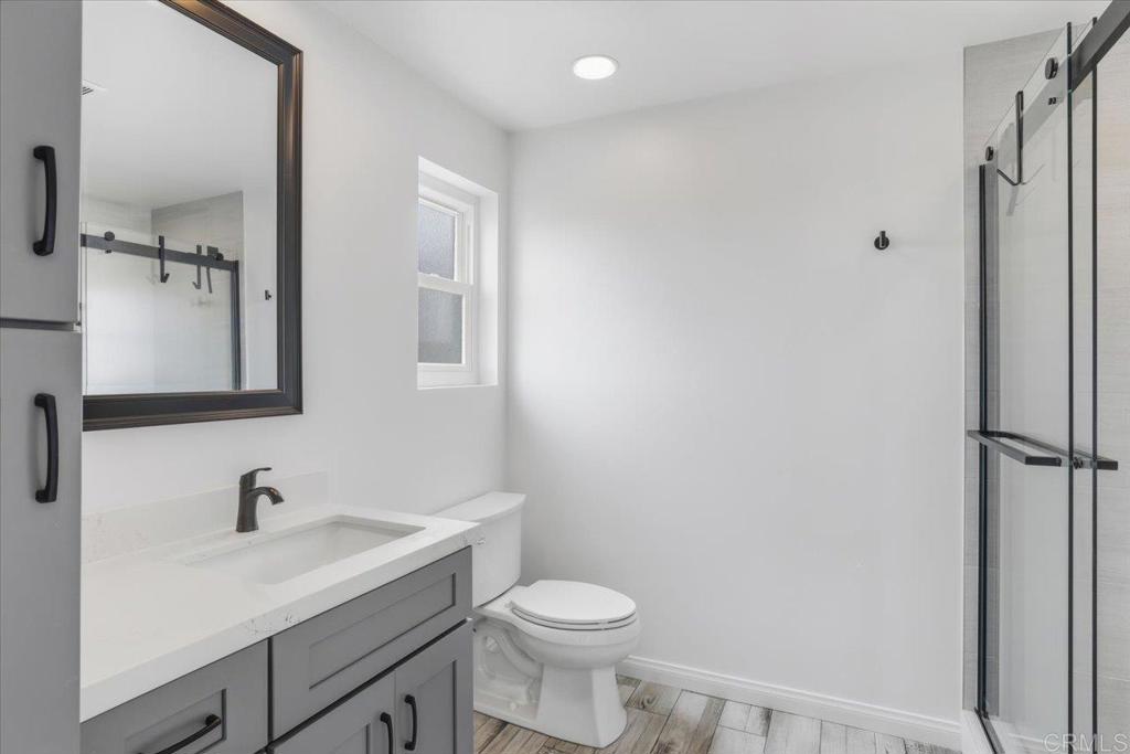 6686 Corte Maria Carlsbad, CA 92009 - Photo 22 of 28 a bathroom with a sink toilet and shower