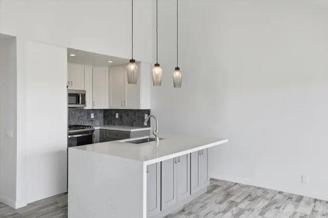 a kitchen with cabinets a sink and dishwasher