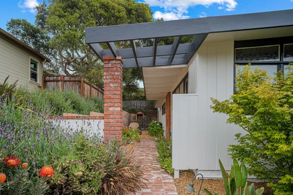 a house view with a backyard space