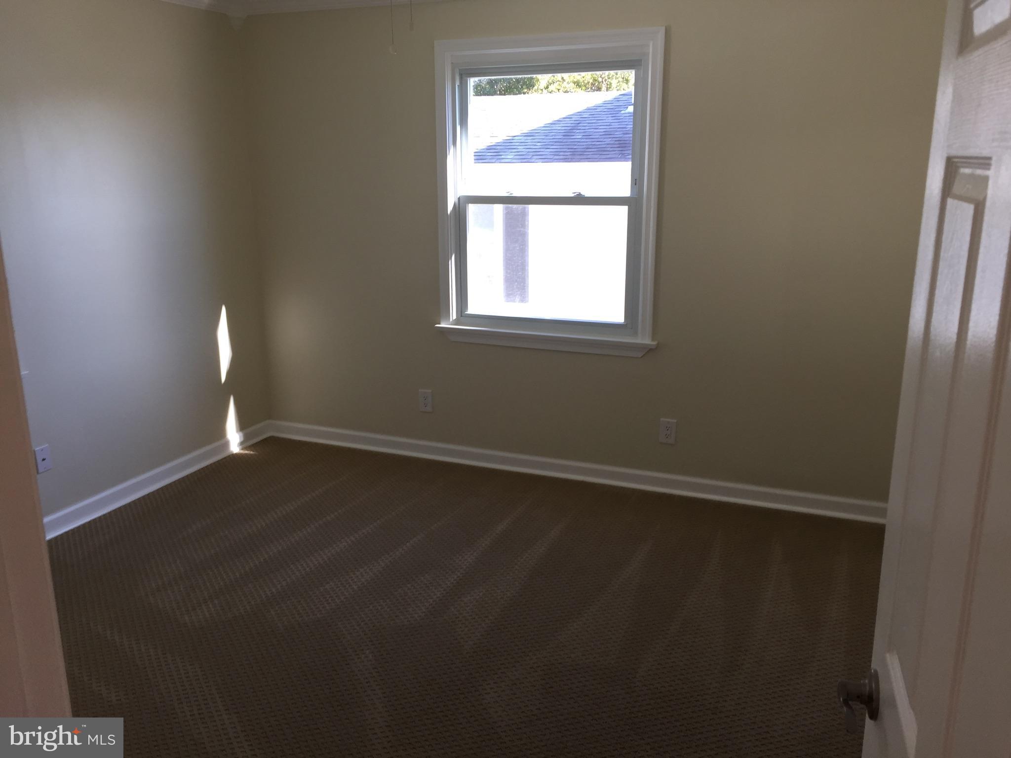 1517 Rita Road Baltimore, MD 21222 - Photo 9 of 12 an empty room with a window