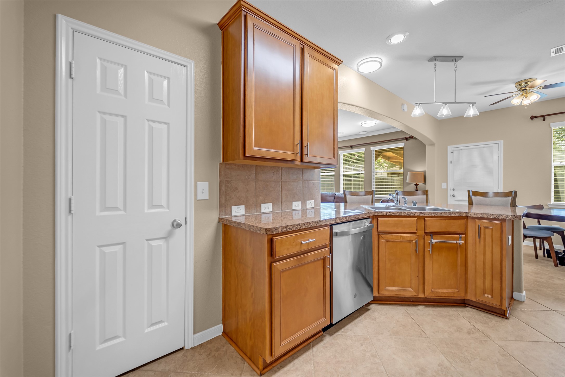 5406 Quarry Ridge Road Richmond, TX 77407 - Photo 14 of 36 Spacious kitchen with abundant cabinetry, easy access to the pantry, generous counter space, and an inviting layout that keeps cooking, conversation, and everyday life beautifully connected.