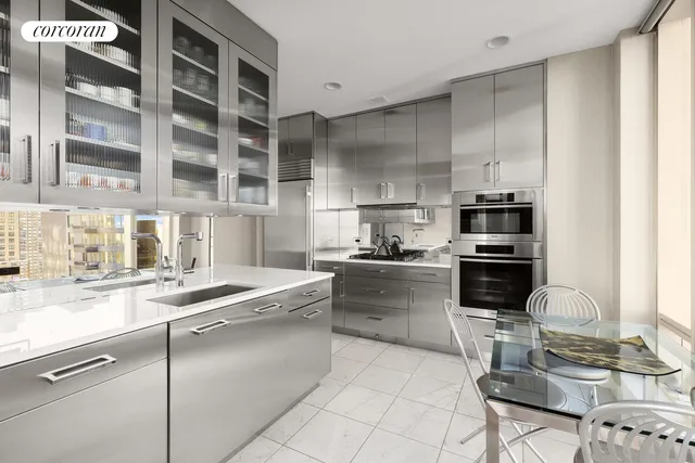 a large kitchen with kitchen island a large window