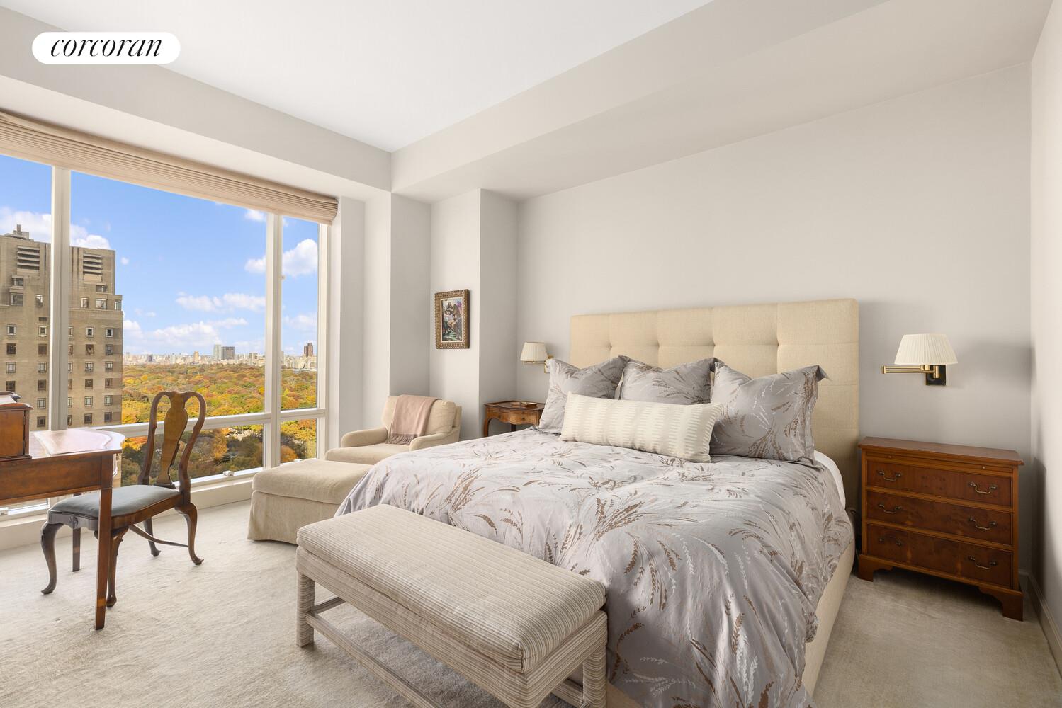 1 Central Park West, Unit 30G Manhattan, NY 10023 - Photo 5 of 10 a bedroom with a bed and a couch