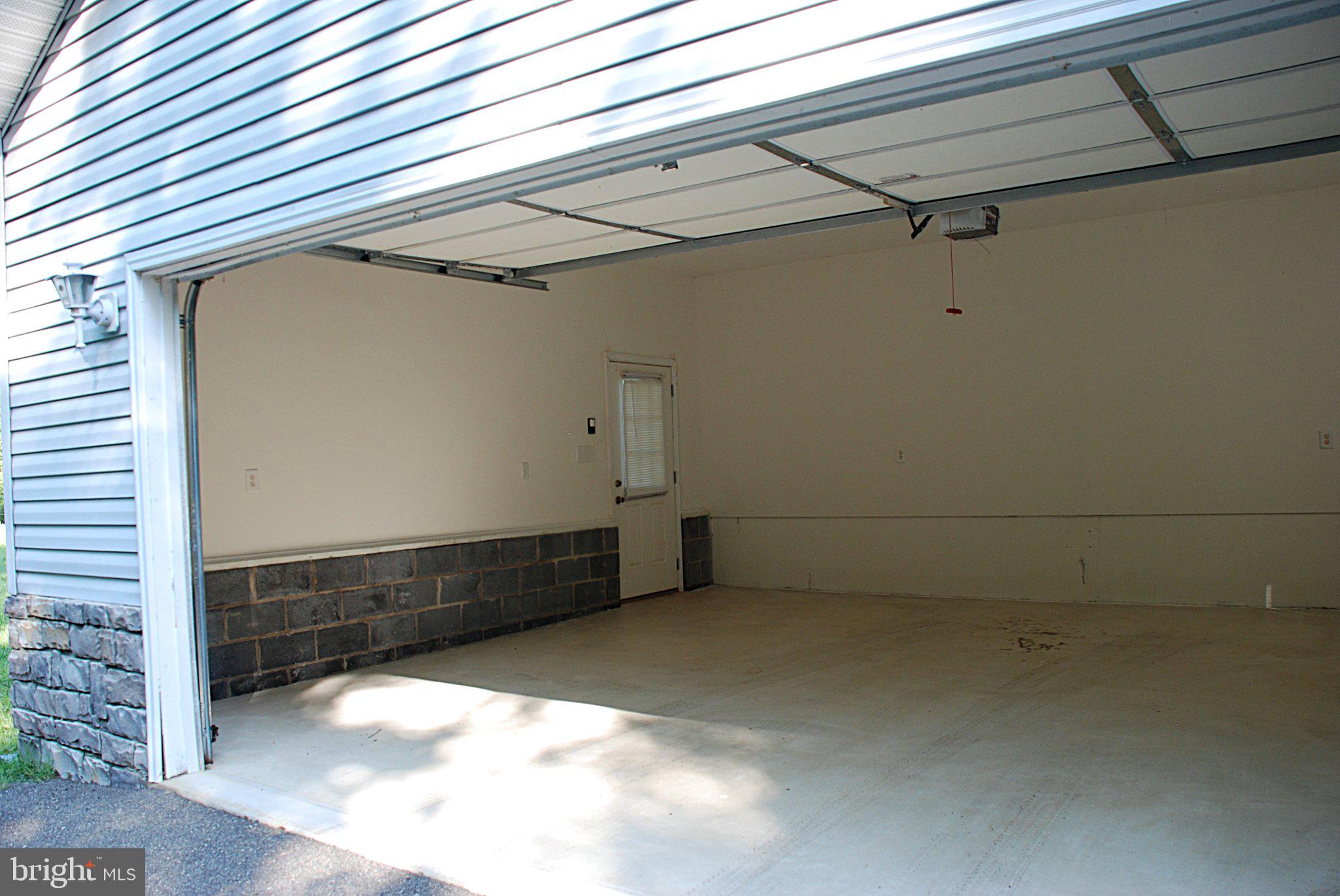 4508 Lewiston Road Bumpass, VA 23024 - Photo 82 of 84 Spacious garage with ample potential.