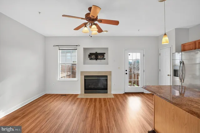 a kitchen with a stove a sink and a refrigerator