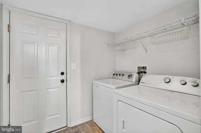 a view of a kitchen with a sink wooden floor and a window