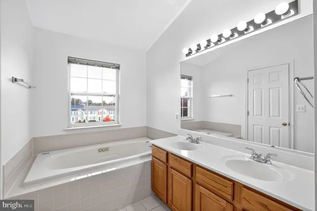 a kitchen with stainless steel appliances granite countertop a stove a refrigerator and a microwave oven