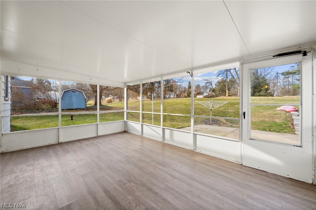 227 South Messner Road New Franklin, OH 44319 - Photo 44 of 44 Unfurnished sunroom with plenty of natural light