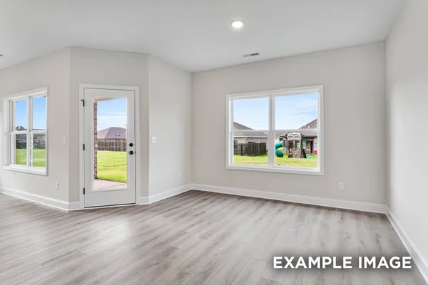 a view of a kitchen with a sink and refrigerator