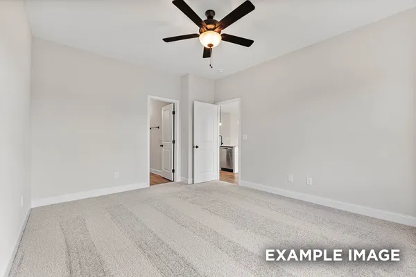 a bathroom with a sink mirror and shower