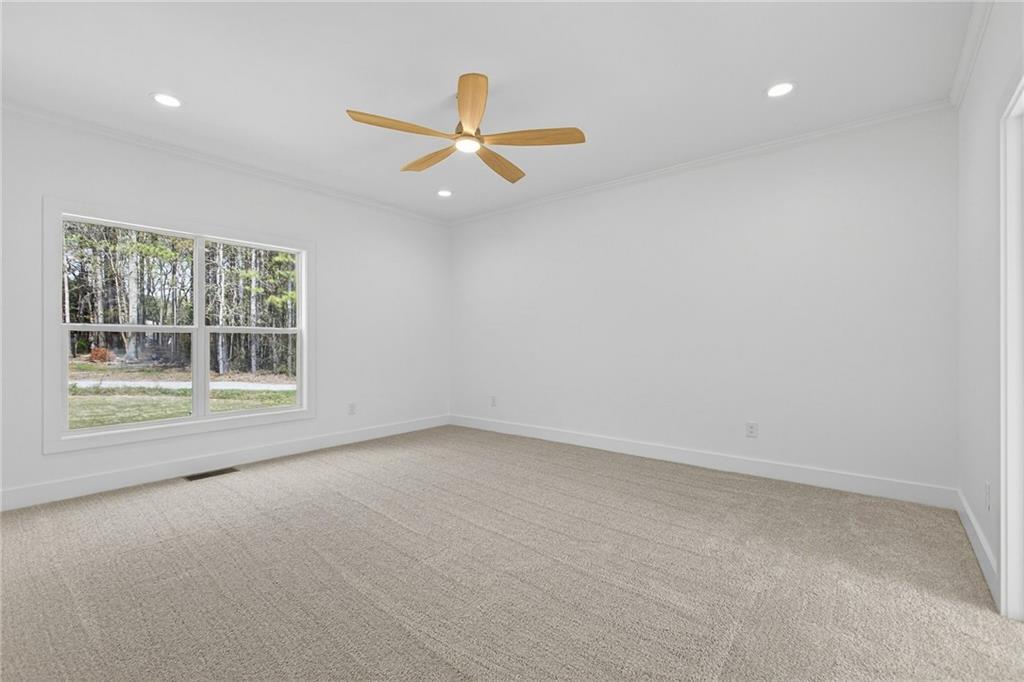 88 Carolyn Path Rockmart, GA 30153 - Photo 25 of 73 an empty room with a window and ceiling fan