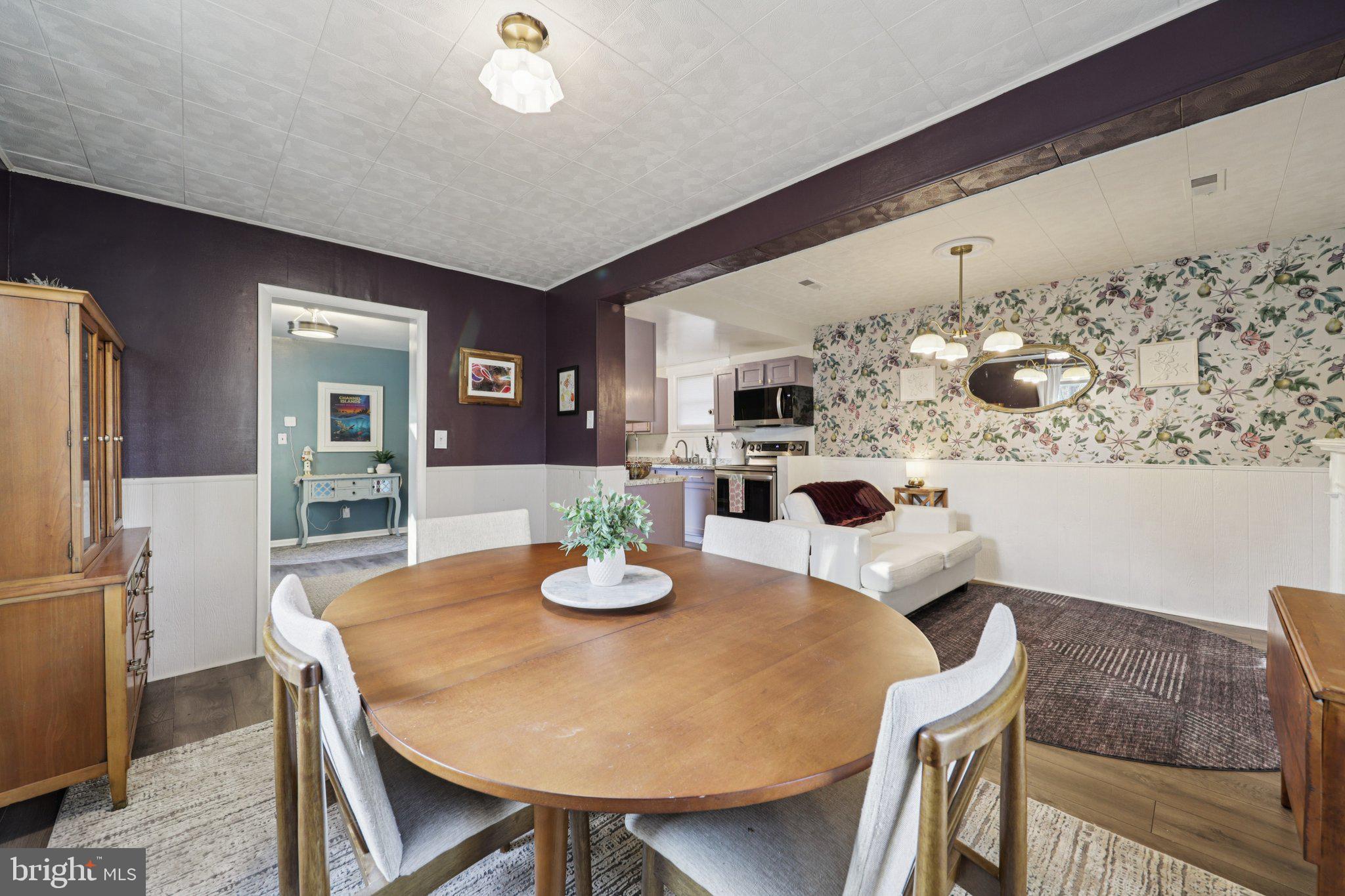 6501 Sligo Parkway Hyattsville, MD 20782 - Photo 14 of 25 a view of a dining room with furniture and wooden floor