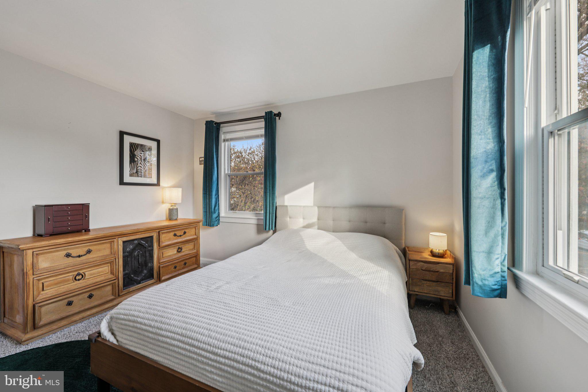 6501 Sligo Parkway Hyattsville, MD 20782 - Photo 16 of 25 a bedroom with a bed and a tv on the dresser