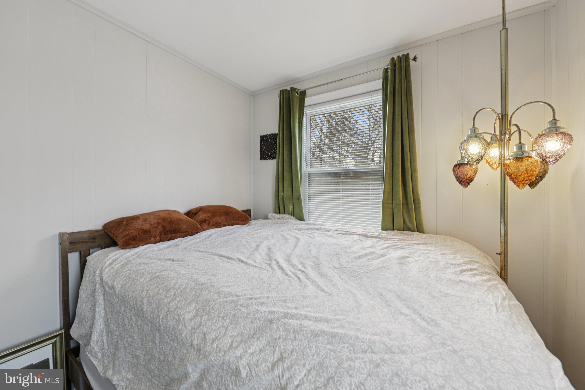 6501 Sligo Parkway Hyattsville, MD 20782 - Photo 18 of 25 a bedroom with a bed and painting on the wall