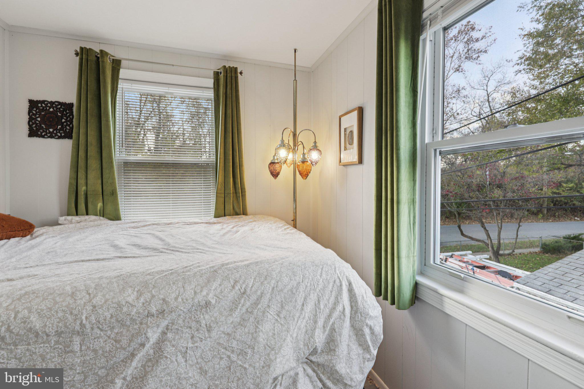 6501 Sligo Parkway Hyattsville, MD 20782 - Photo 19 of 25 a bedroom with a bed and a painting on the wall
