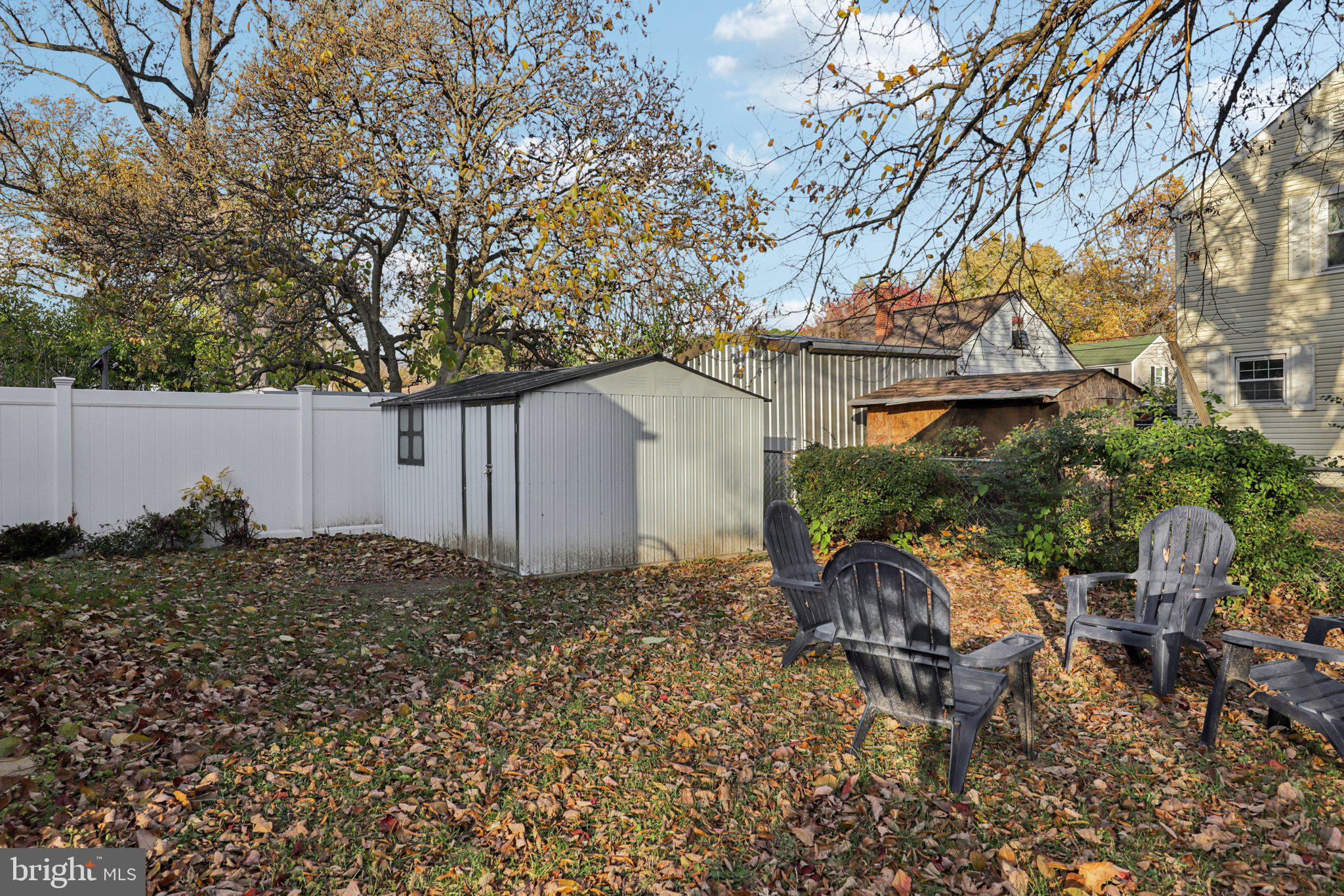 6501 Sligo Parkway Hyattsville, MD 20782 - Photo 23 of 25 a backyard of a house with table and chairs and wooden fence