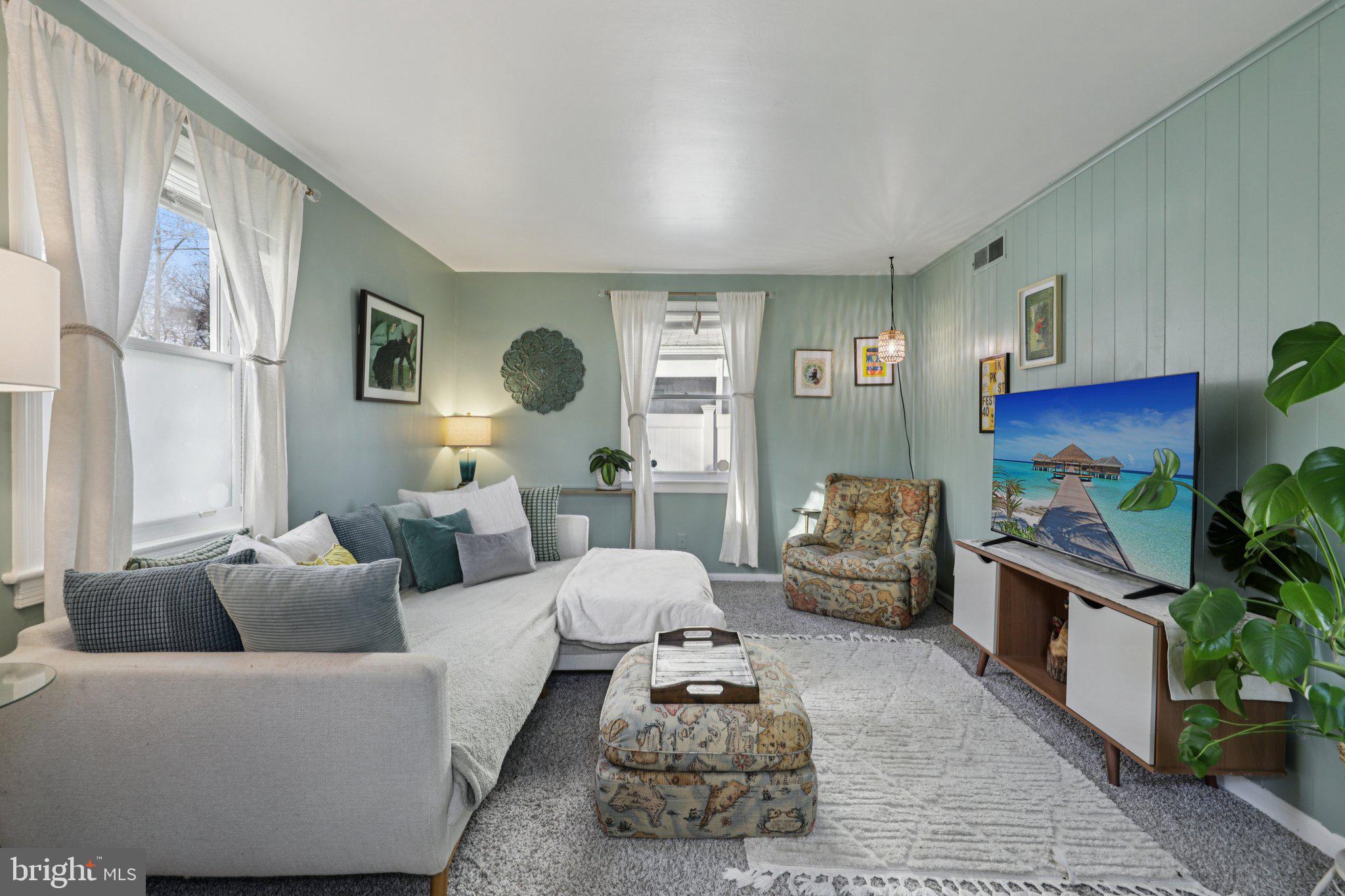 6501 Sligo Parkway Hyattsville, MD 20782 - Photo 5 of 25 a living room with furniture fireplace and a large window