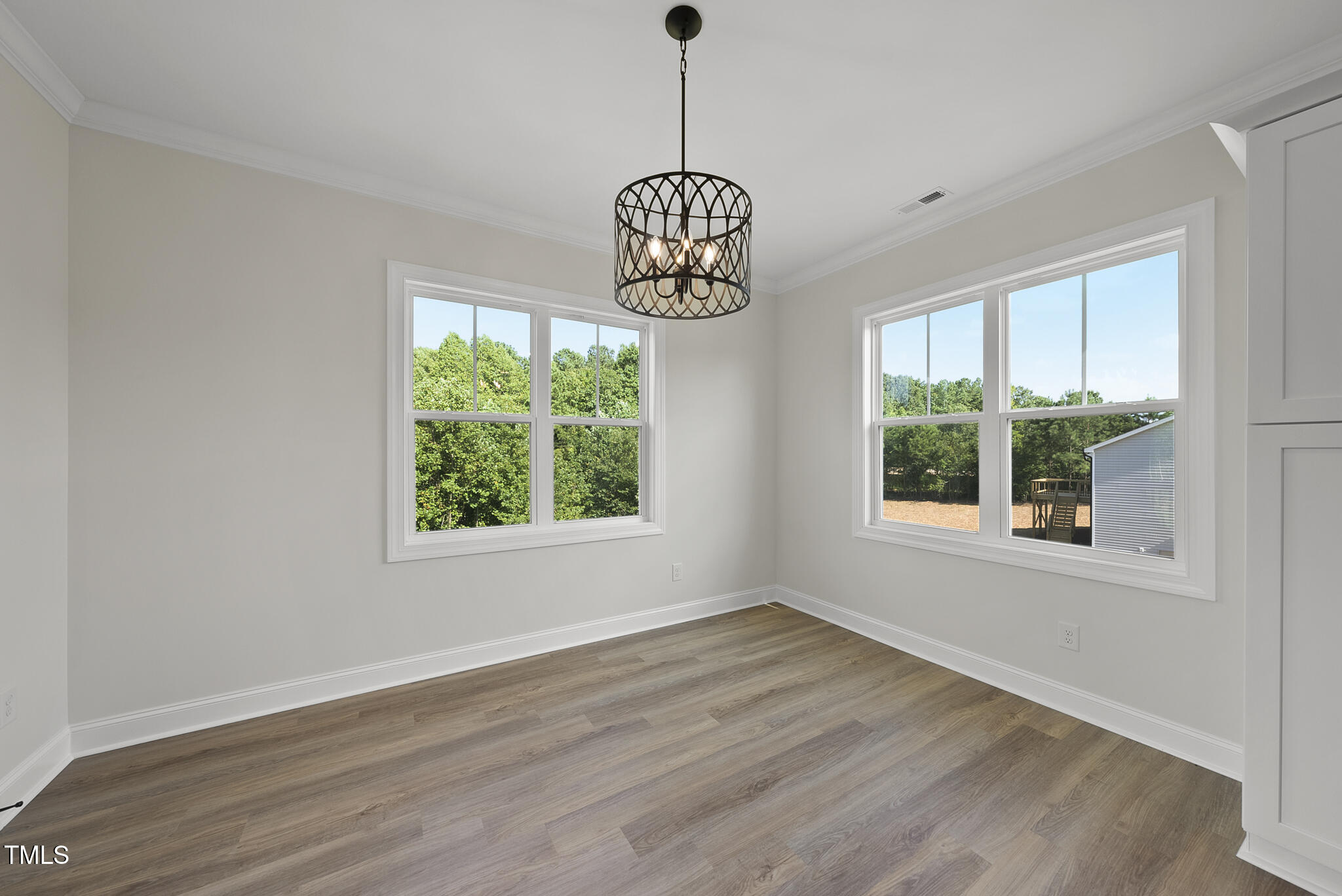 30 Morning Dew Way Spring Hope, NC 27882 - Photo 8 of 23 a view of an empty room with wooden floor and a window