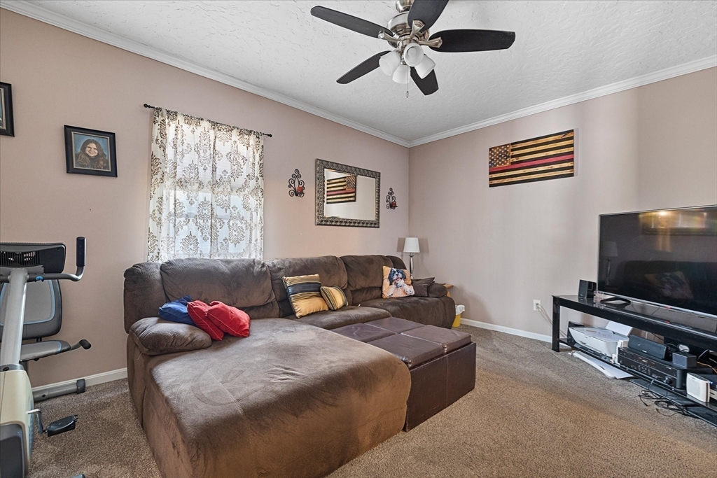 19 Schofield Avenue Dudley, MA 01571 - Photo 11 of 31 a bedroom with furniture and a flat screen tv