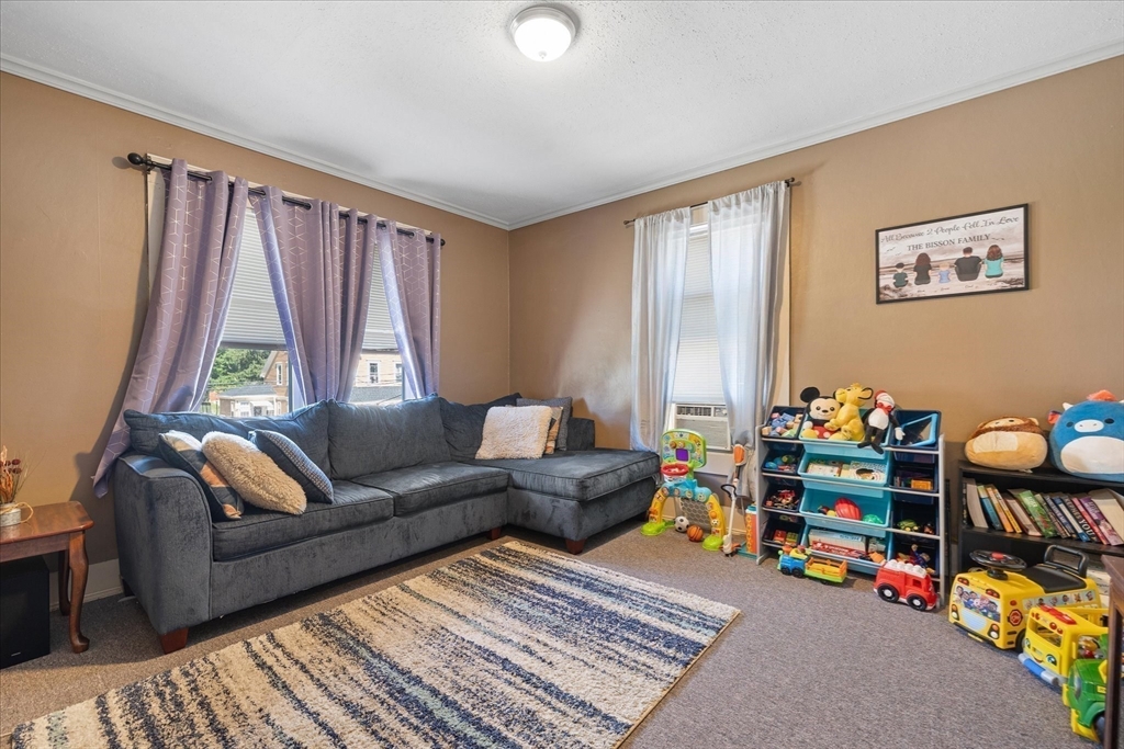 19 Schofield Avenue Dudley, MA 01571 - Photo 16 of 31 a living room with furniture and a window
