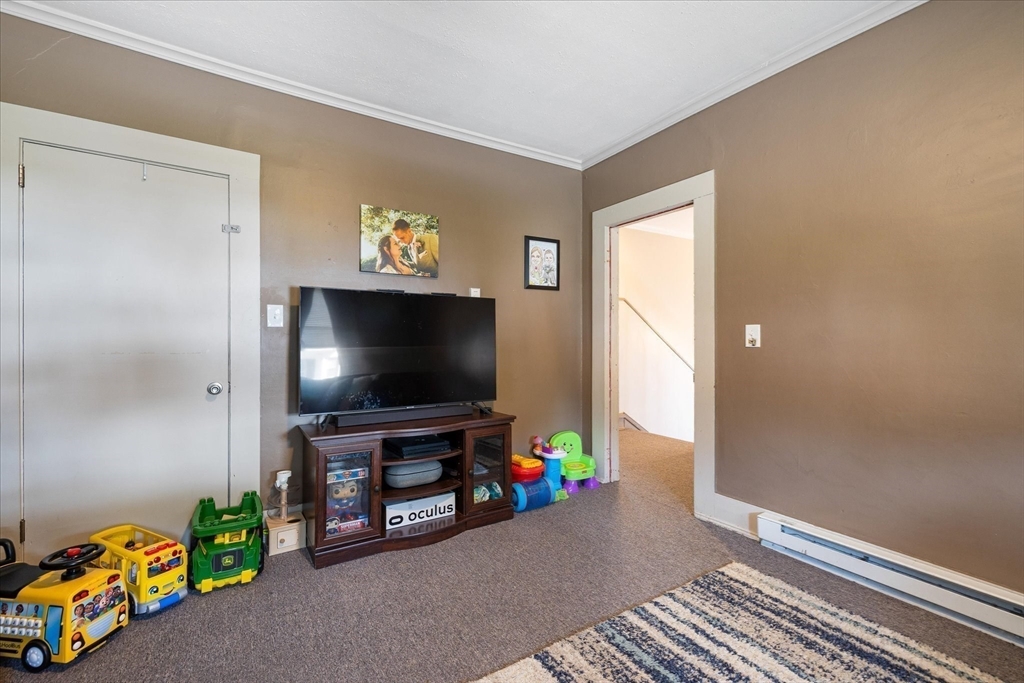 19 Schofield Avenue Dudley, MA 01571 - Photo 17 of 31 a living room with furniture and a flat screen tv