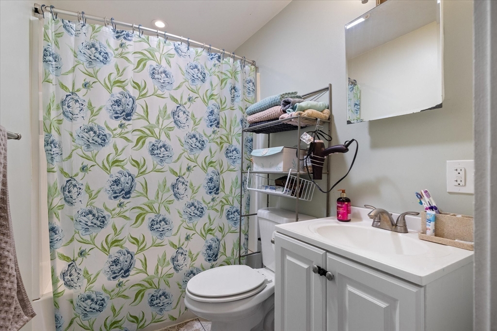 19 Schofield Avenue Dudley, MA 01571 - Photo 24 of 31 a bathroom with a sink toilet and shower curtain