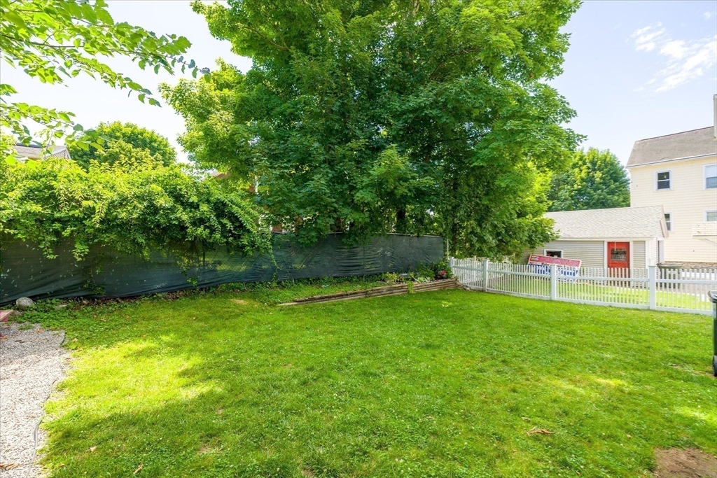 19 Schofield Avenue Dudley, MA 01571 - Photo 30 of 31 a view of a backyard with a small cabin