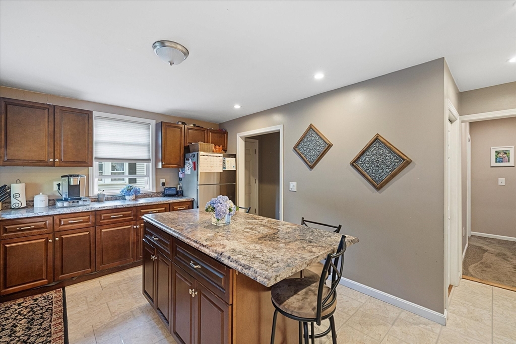 19 Schofield Avenue Dudley, MA 01571 - Photo 3 of 31 a kitchen with granite countertop a sink and cabinets