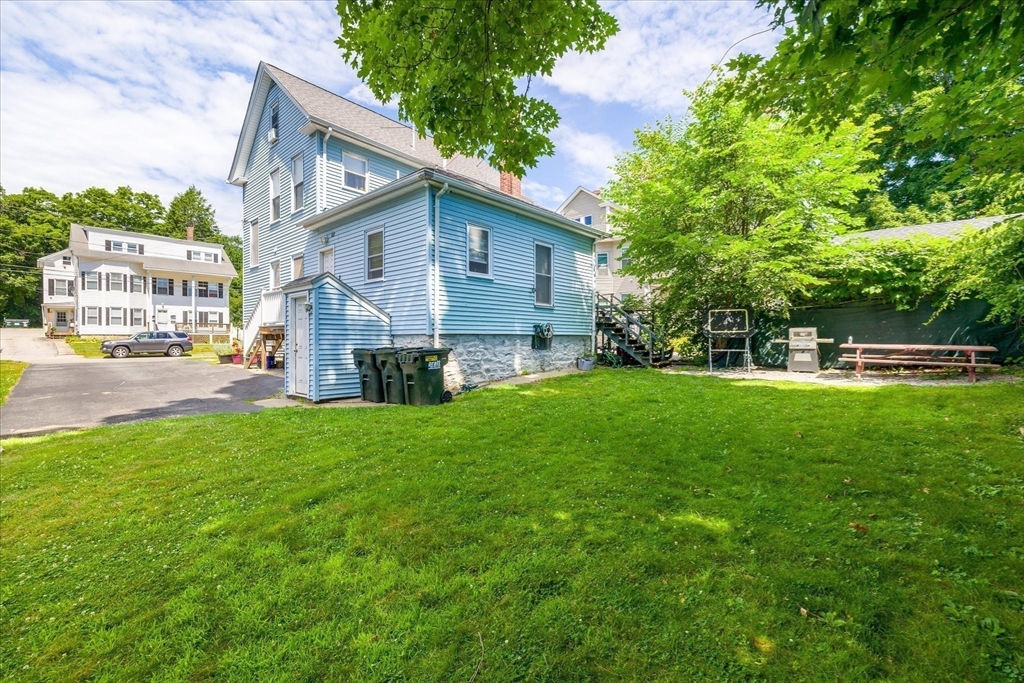 19 Schofield Avenue Dudley, MA 01571 - Photo 31 of 31 a view of a house with backyard and a tree