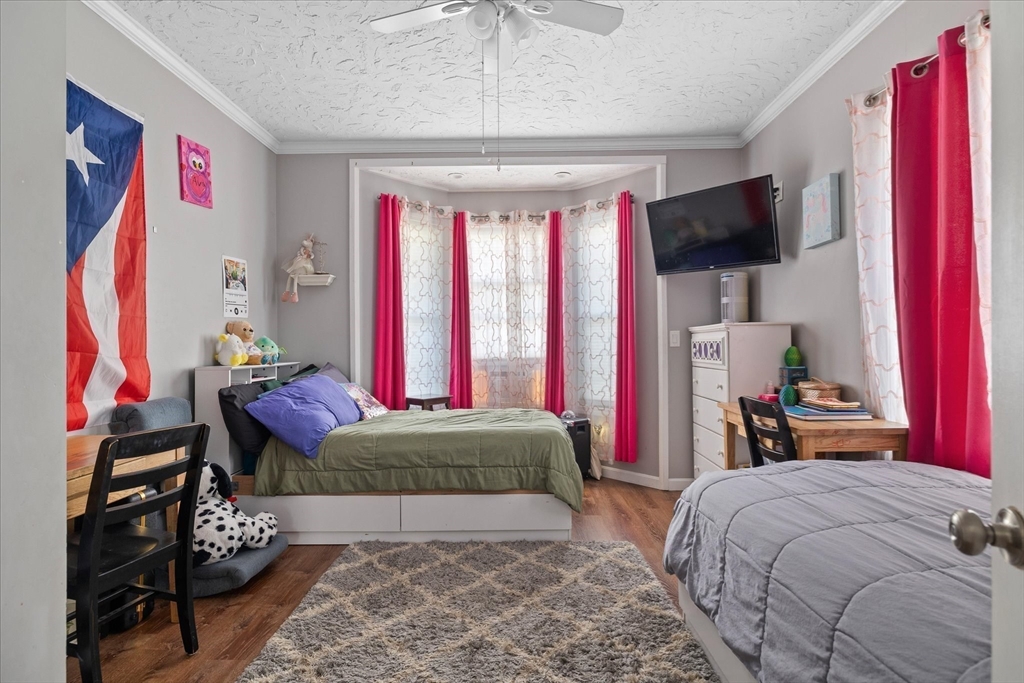 19 Schofield Avenue Dudley, MA 01571 - Photo 8 of 31 a bedroom with a bed and a flat screen tv