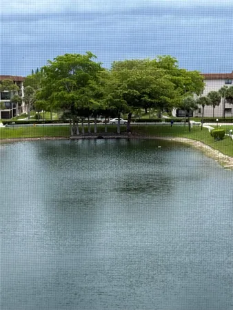 a view of a lake with a building in the background