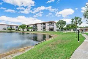 a view of a lake with a yard