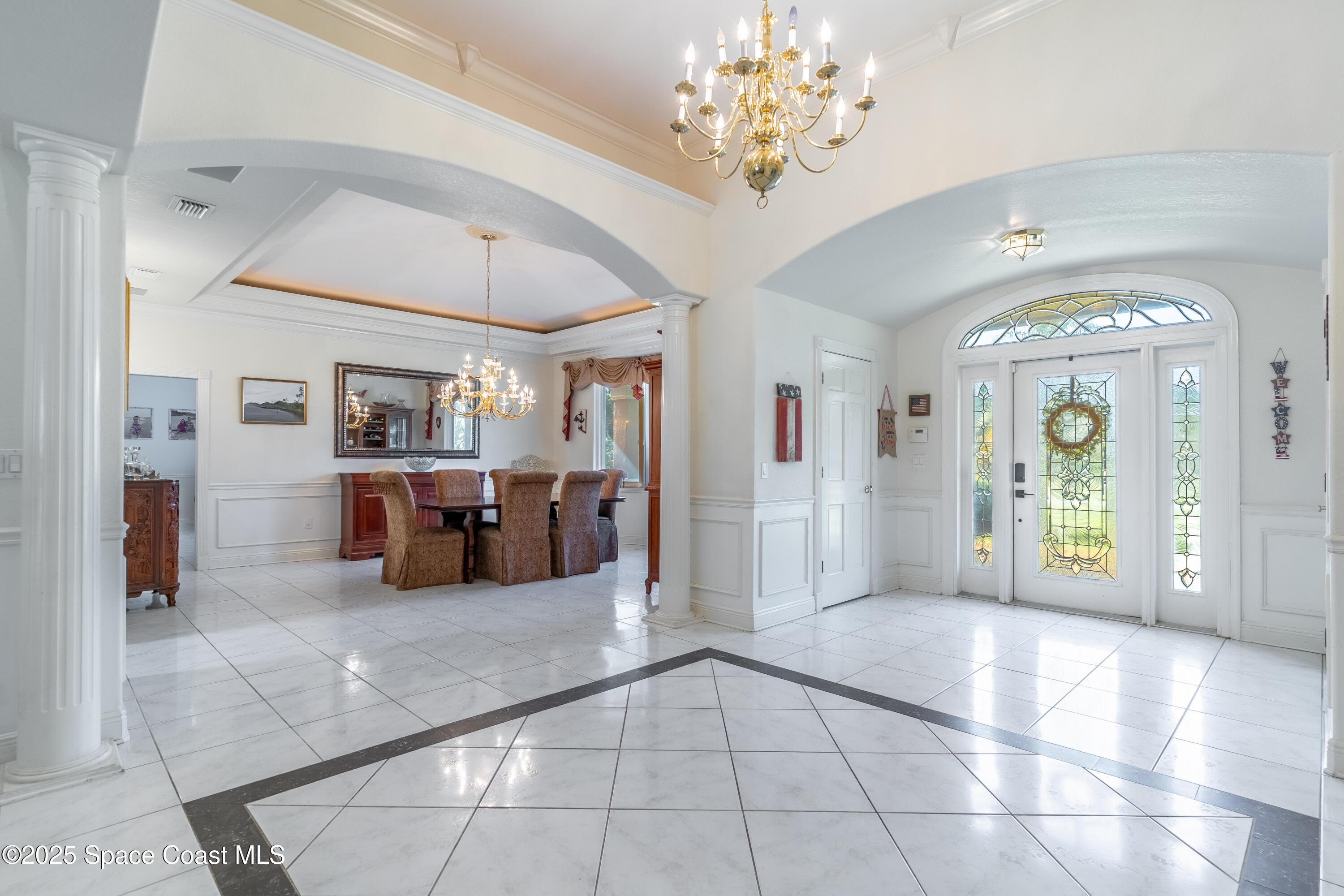 150 Utopia Circle Merritt Island, FL 32952 - Photo 12 of 52 a large hall with a chandelier