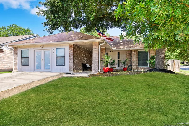 a front view of house with yard and outdoor seating