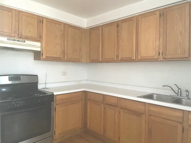 a kitchen with a sink and cabinets