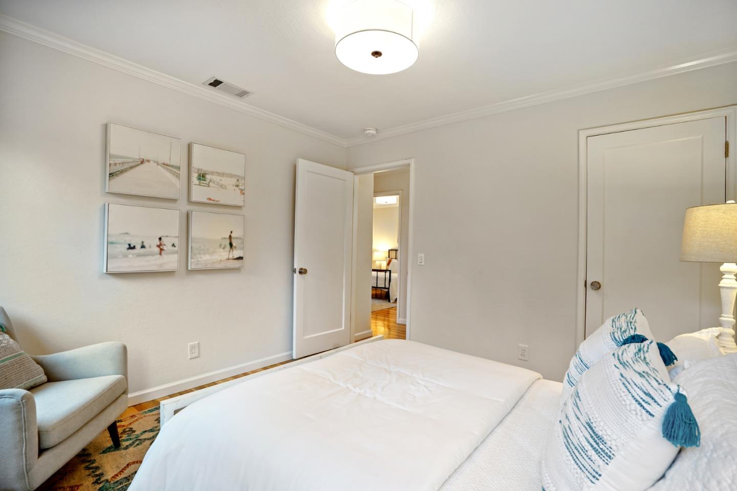 316 McKendry Drive Menlo Park, CA 94025 - Photo 12 of 21 a bedroom with a bed and a couch