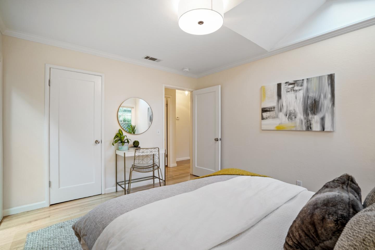 316 McKendry Drive Menlo Park, CA 94025 - Photo 15 of 21 a bedroom with a bed and a chandelier