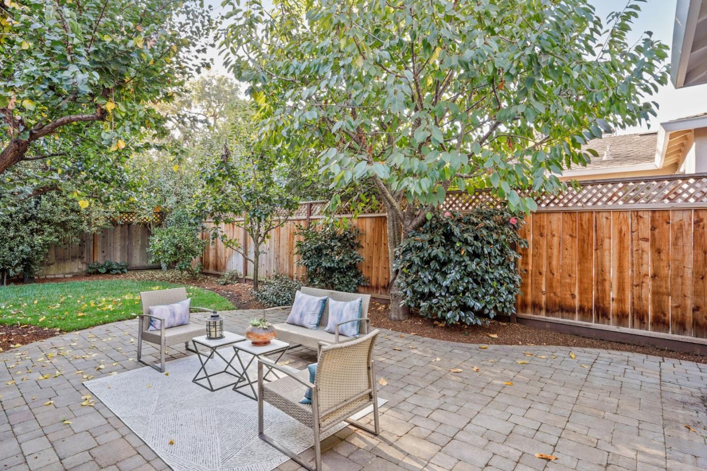 316 McKendry Drive Menlo Park, CA 94025 - Photo 17 of 21 a view of a chairs and table in backyard of the house