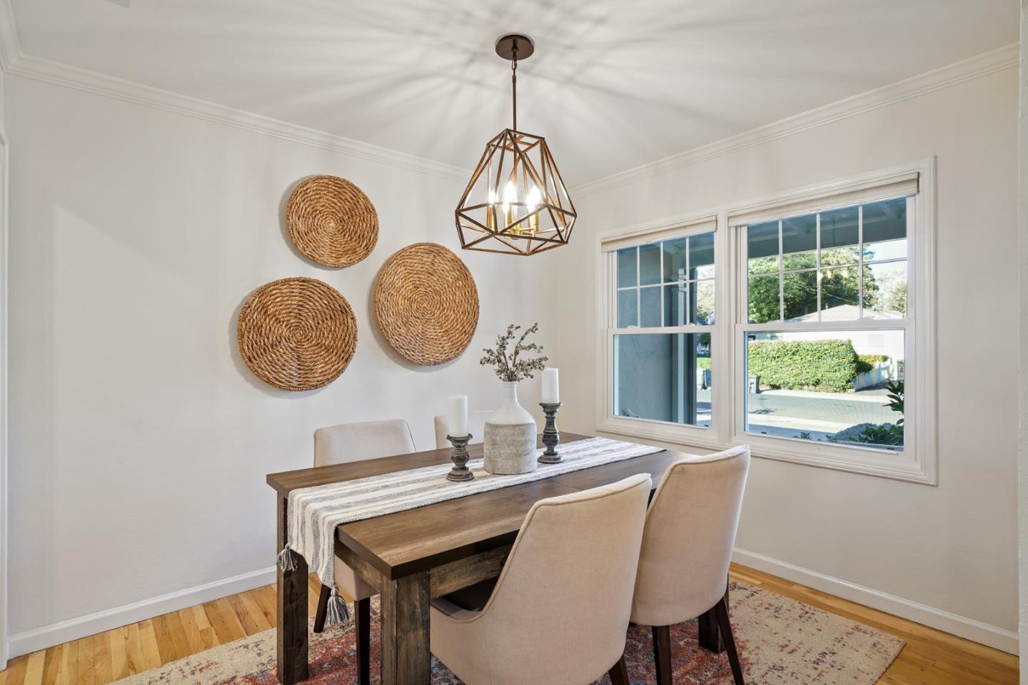 316 McKendry Drive Menlo Park, CA 94025 - Photo 6 of 21 a dining room with wooden floor and a chandelier