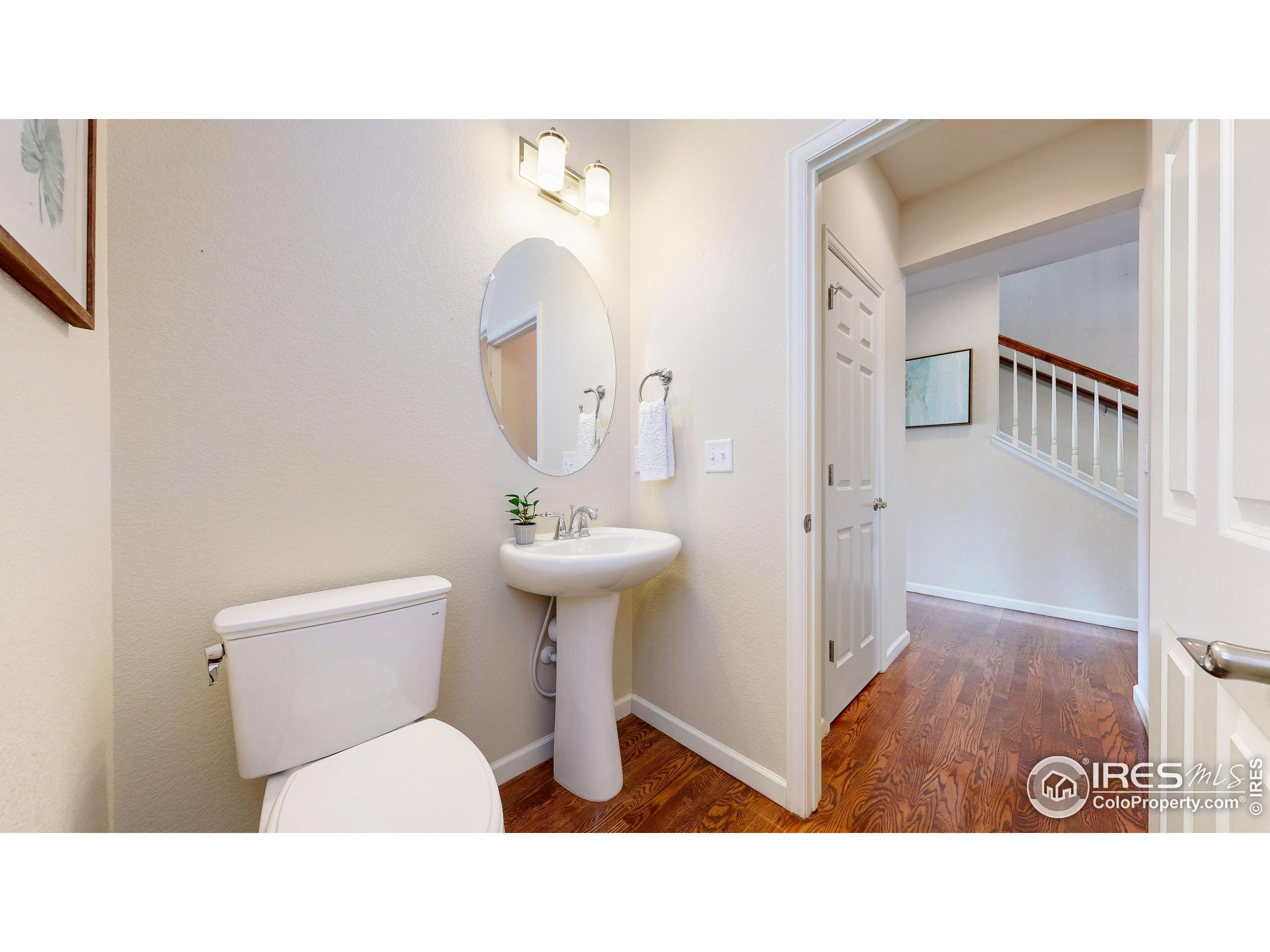 6748 Rainier Road Timnath, CO 80547 - Photo 13 of 34 a bathroom with a sink a toilet and shower