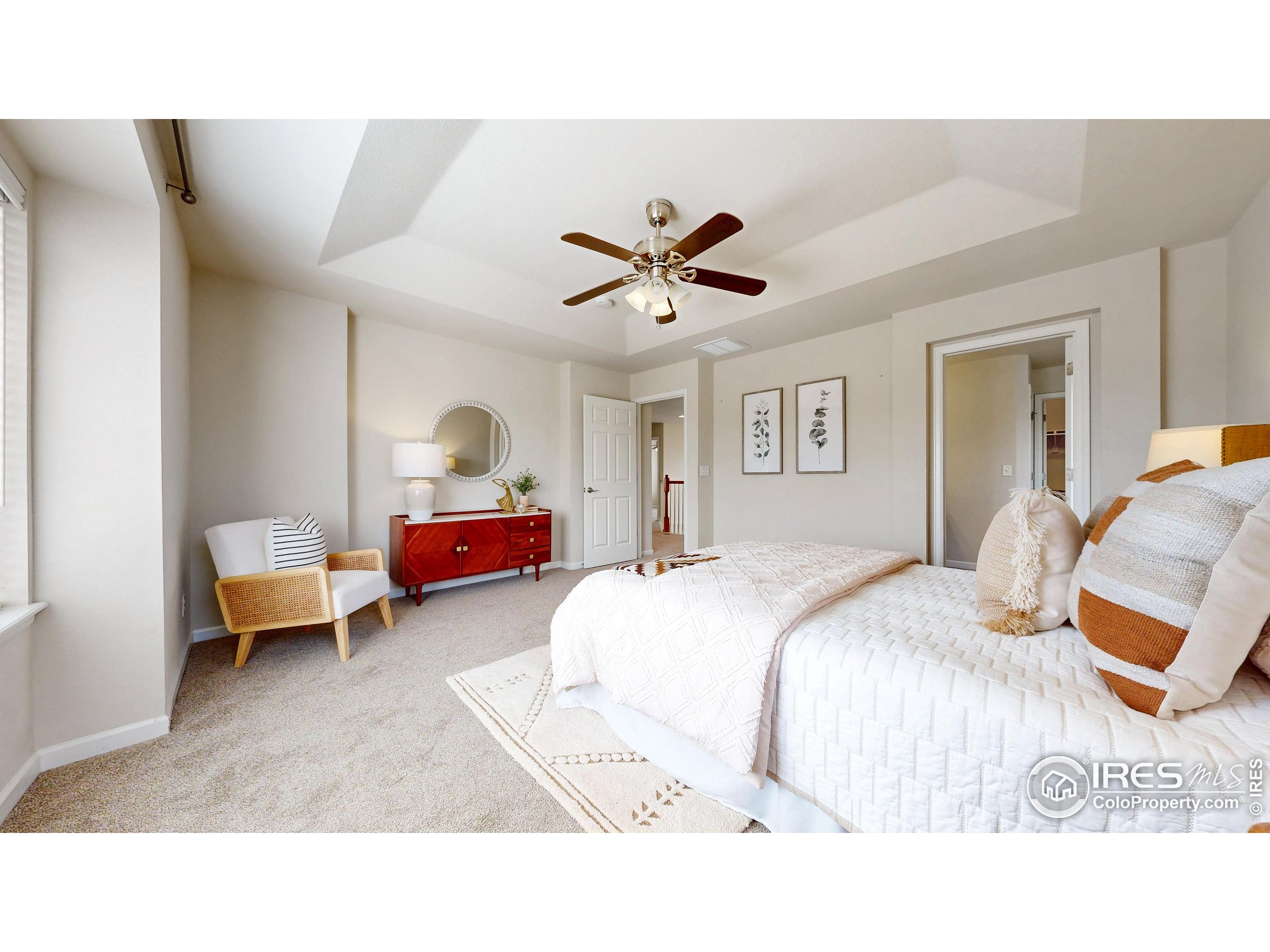 6748 Rainier Road Timnath, CO 80547 - Photo 15 of 34 a living room with furniture and a ceiling fan