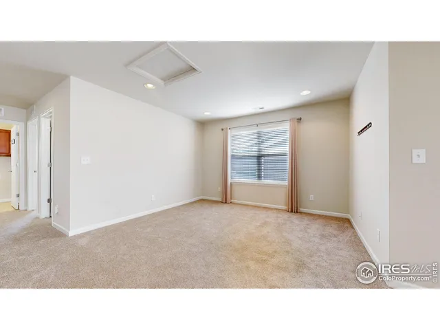 a open hall with a floor to ceiling window