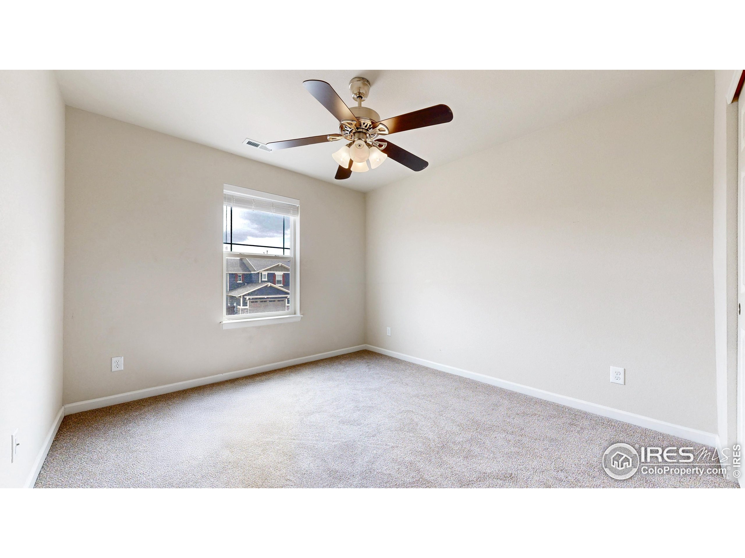 6748 Rainier Road Timnath, CO 80547 - Photo 22 of 34 a open hall with a ceiling fan