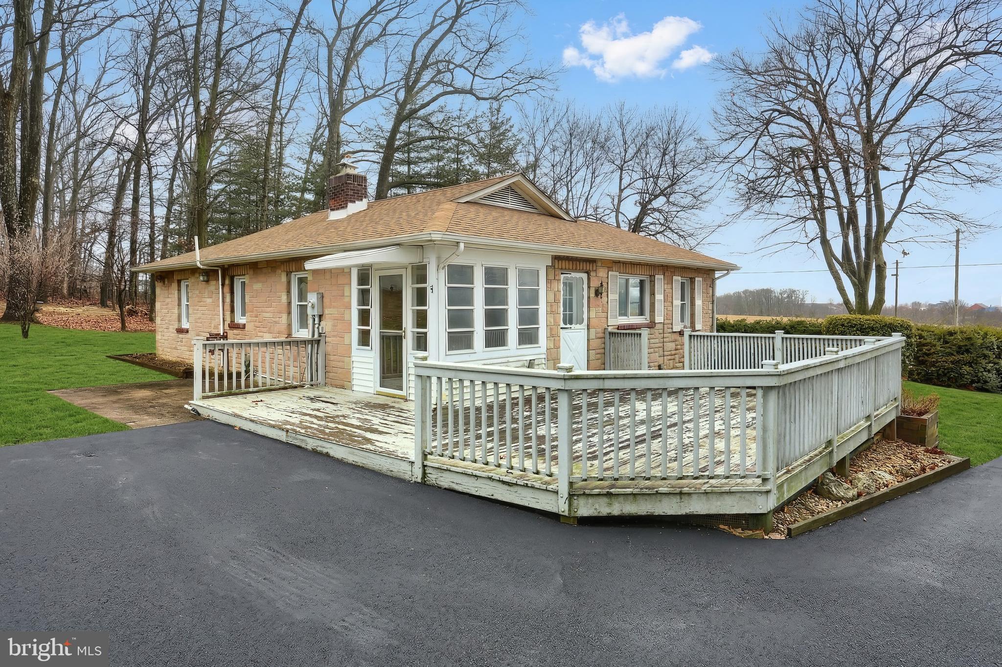754 Bridgeton Road Fawn Grove, PA 17321 - Photo 17 of 42 a front view of a house with a garden