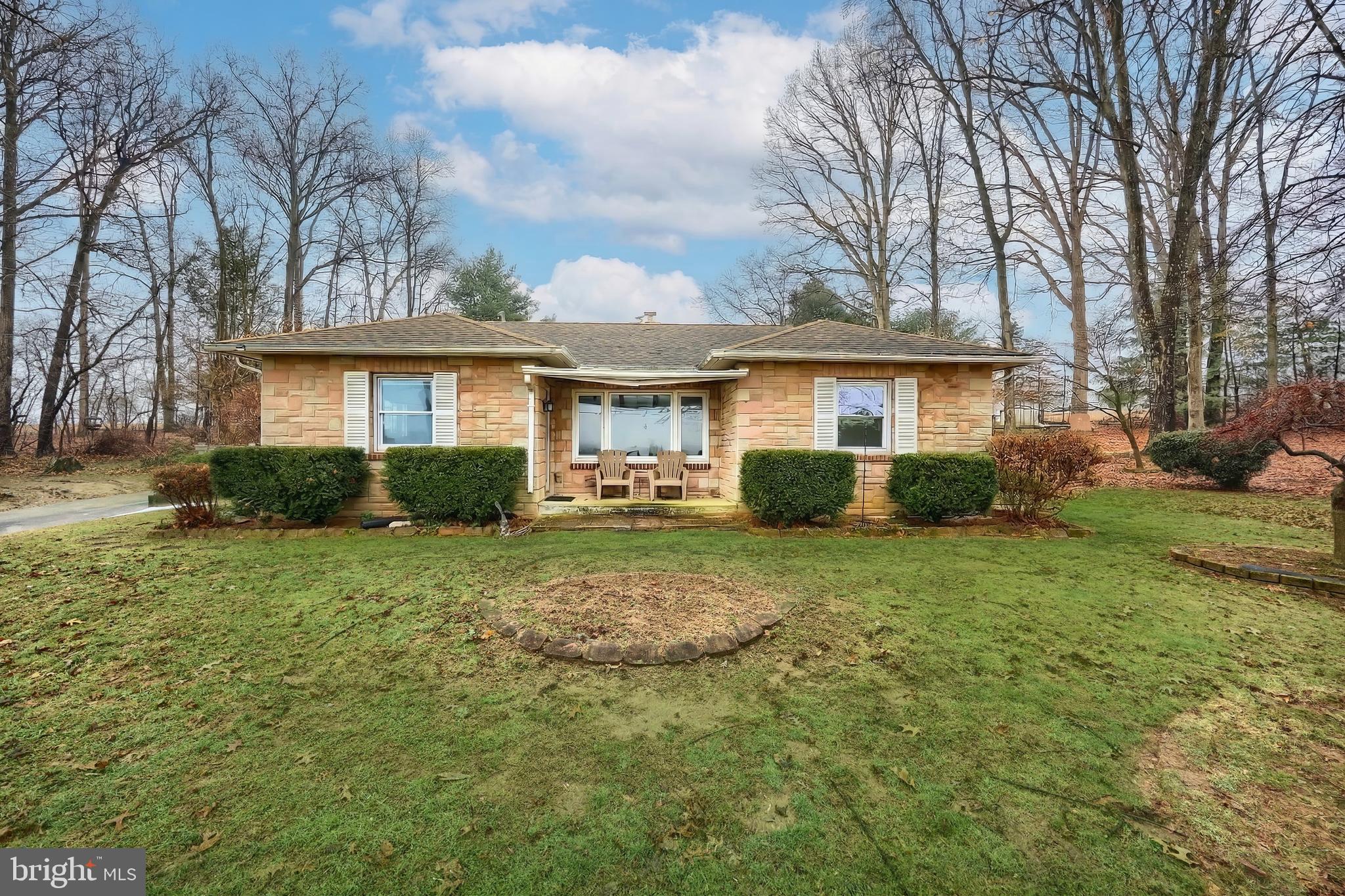 754 Bridgeton Road Fawn Grove, PA 17321 - Photo 19 of 42 a front view of a house with a yard