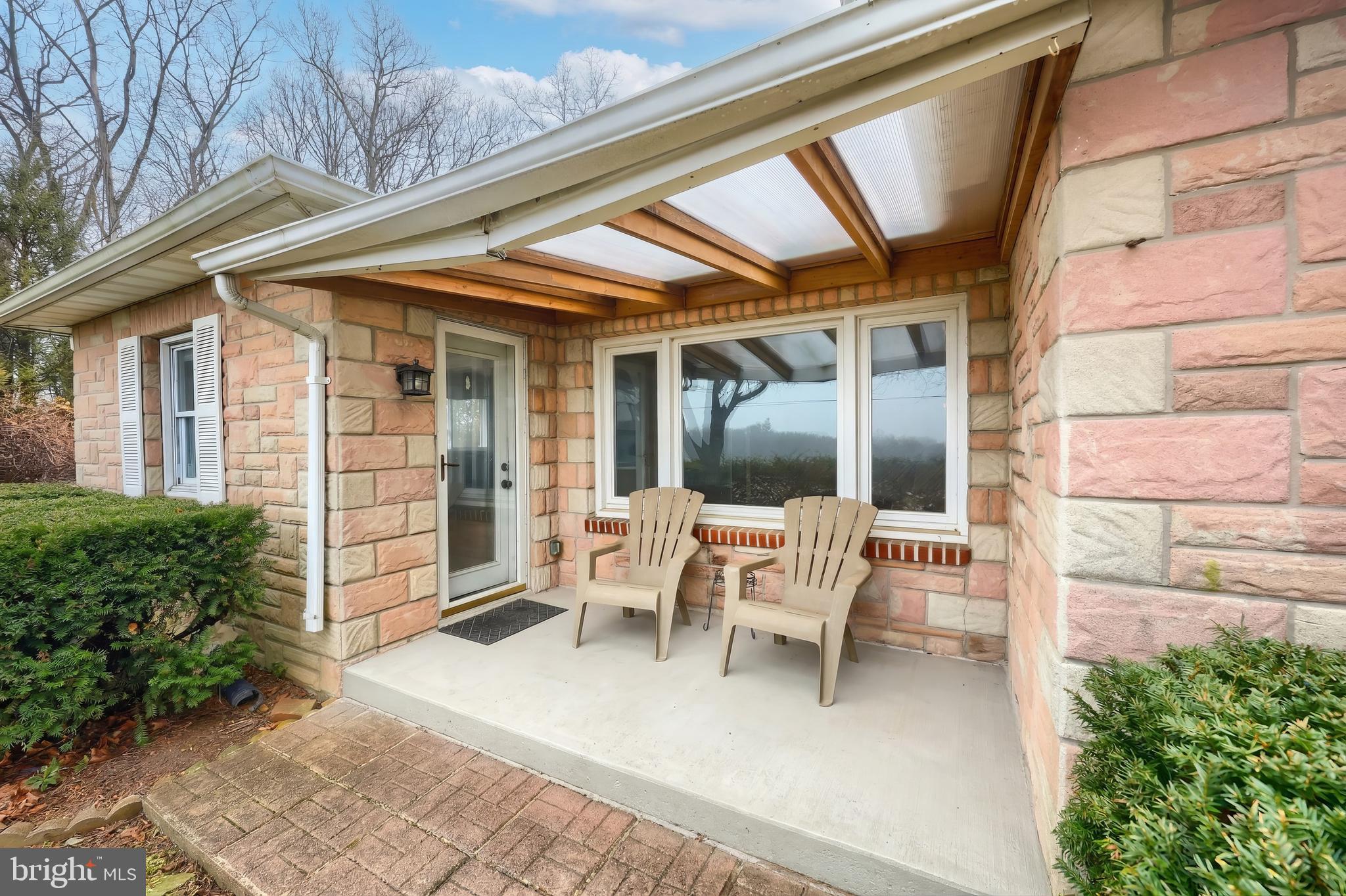 754 Bridgeton Road Fawn Grove, PA 17321 - Photo 20 of 42 a view of a patio with table and chairs and potted plants